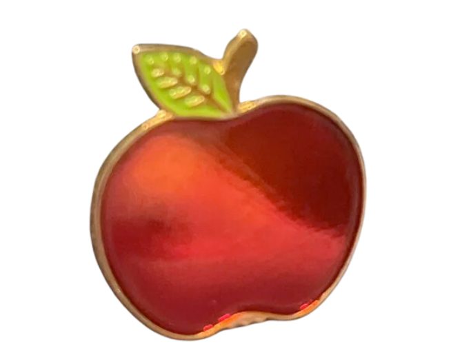 a pin of a shiny red apple