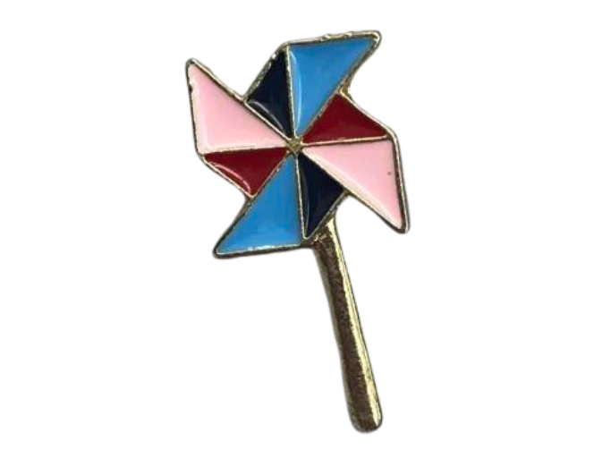 an enamel pin shaped like a pinwheel