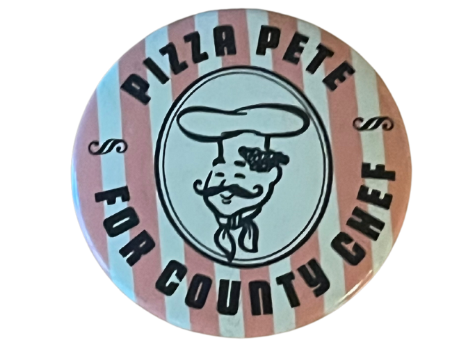 a pink and white button with a picture of a chef that reads: pizza pete for county chef