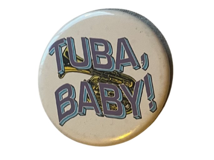 a button that reads 'Tuba, baby!' The text is overlayed over a tuba.